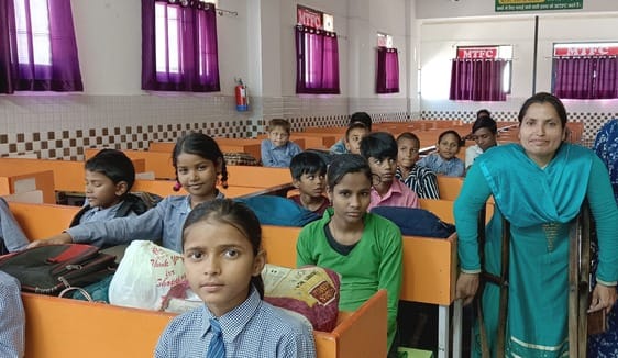 Unable to walk, Sarita is showing the path to the future to the children.