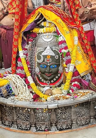 Bhasma Aarti - Baba Mahakal adorned with moon, crown and earrings in ears