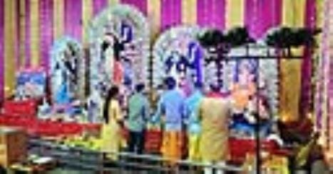 Pilgrims worship in Durga Pandaal