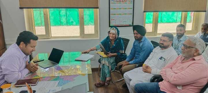 The MLA discussed development with the Municipal Commissioner