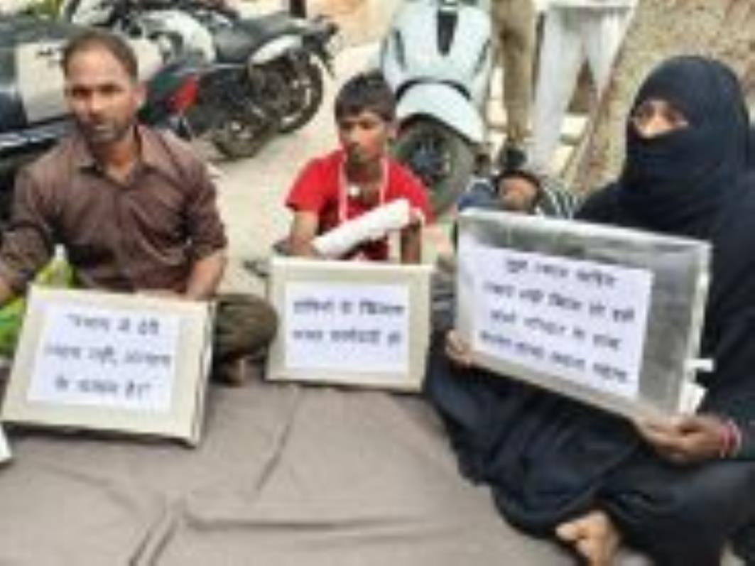 The victim staged a sit-in protest with his family in front of the CO office