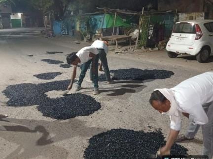 Officials came out on the roads to fill the potholes