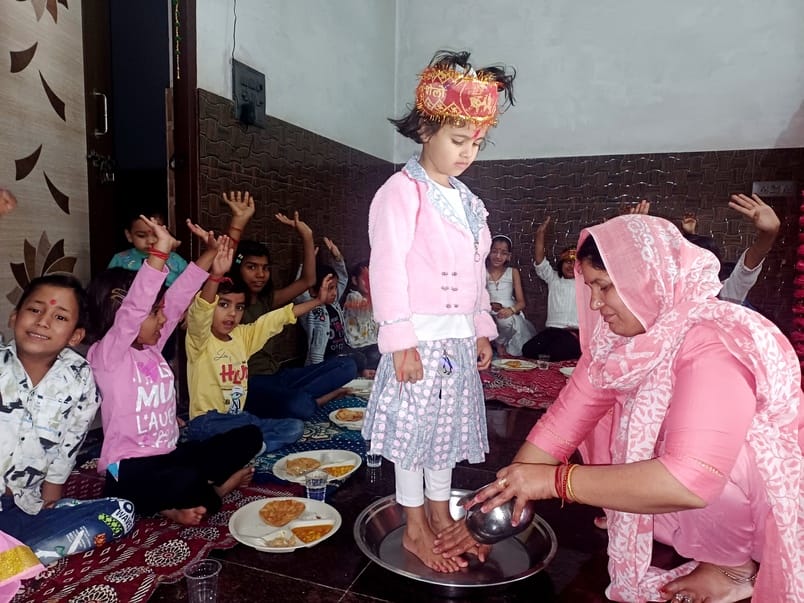 After worshipping Mahagauri, girls were given a feast on Ashtami