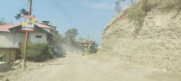 Dust flying in Tauni Devi during NH construction work