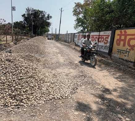 Excavated road stones are causing trouble to pedestrians, shopkeepers are troubled by dust