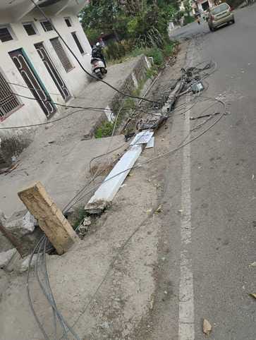 Electricity poles and wires broken due to falling of trees, supply disrupted