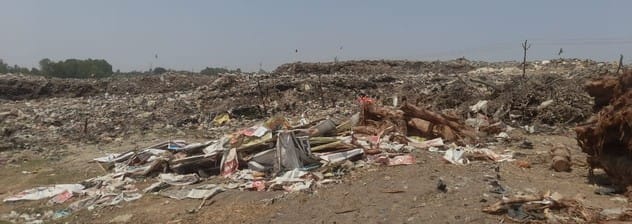 Claims buried in garbage heaps... Manure being buried in pits