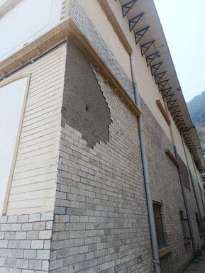 Chairs are broken in the auditorium, the wall of Atal Sadan is crumbling outside