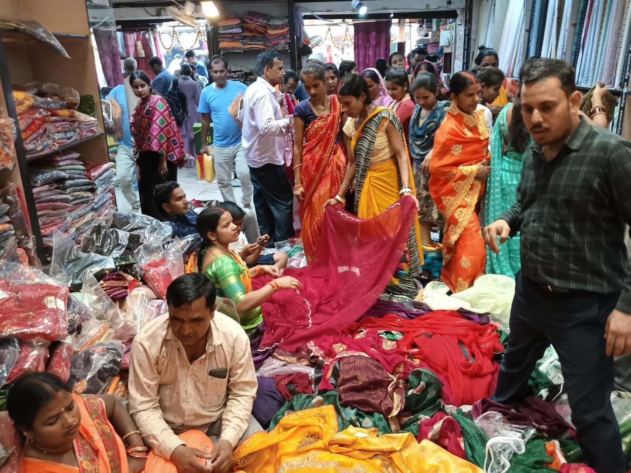 The market is bustling with activity, shopping is going on fiercely