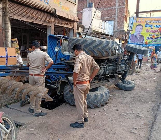Hydra tractor overturned, transformer and sweet shop damaged