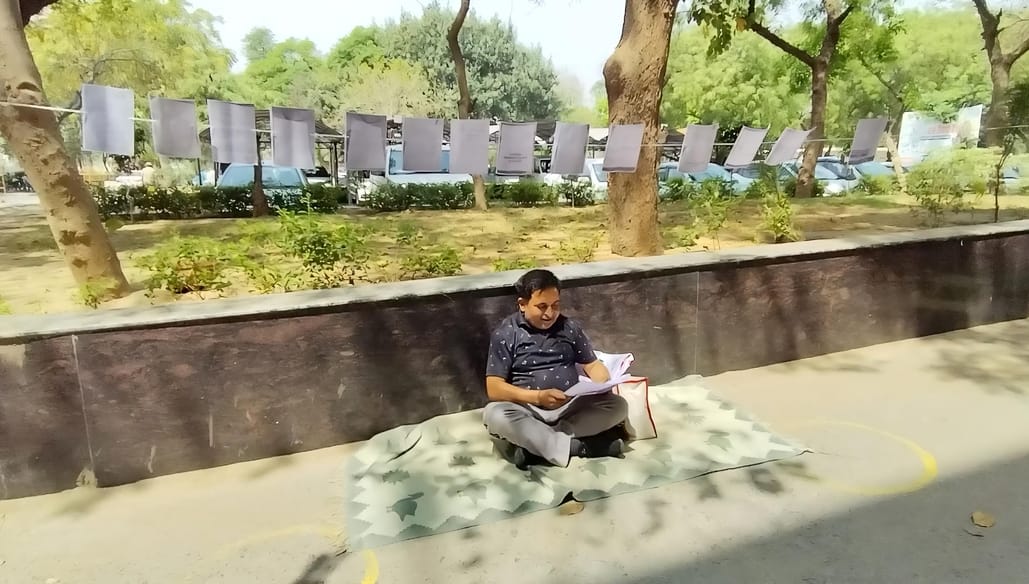 When no one listened to him, he made a 20 feet long list of complaints and sat on a dharna