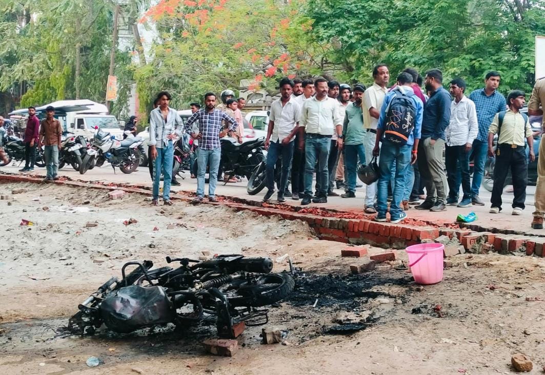 The student was stopped and beaten, his bike was also burnt