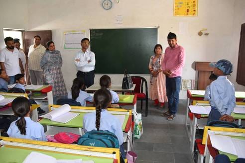 ACS heard poems from first class students, fifth class students recited tables in English
