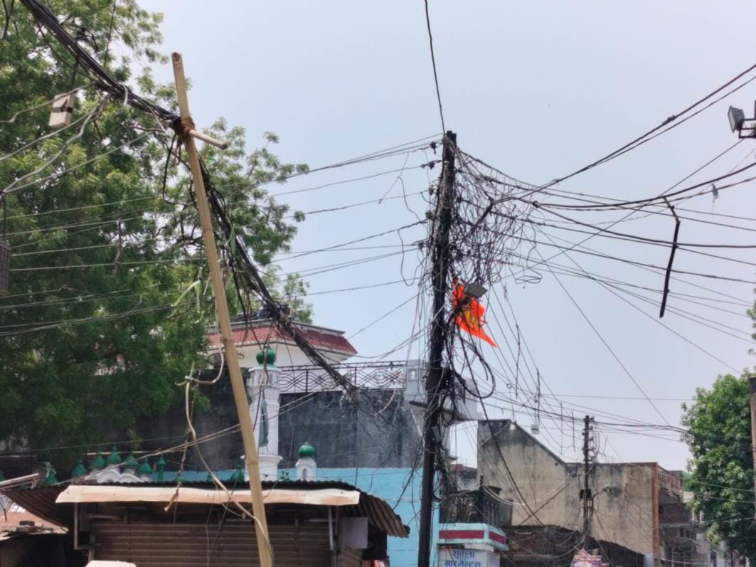 Wires hanging on electricity poles are giving current to the system