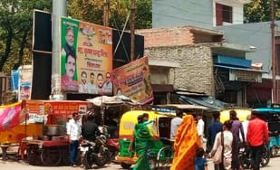 Electricity poles on the highway in Tilhar are filled with illegal hoardings