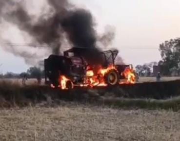 Tractor loaded with thresher machine burnt after touching HT line wire, two injured