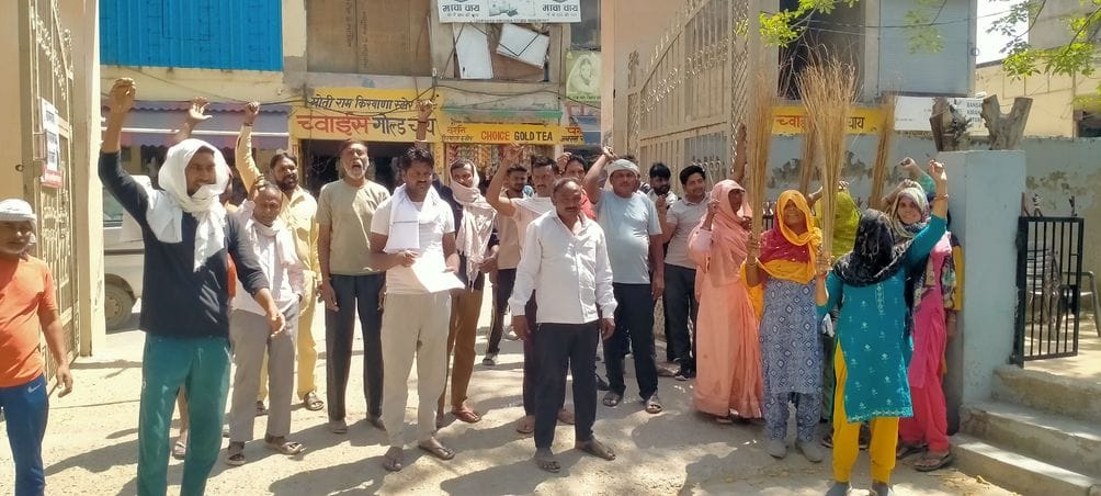 Cleaning workers demonstrated with brooms