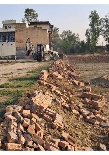 DTP team operated JCB in illegal colony