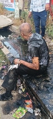 Man falls into drain on Delhi road after slipping