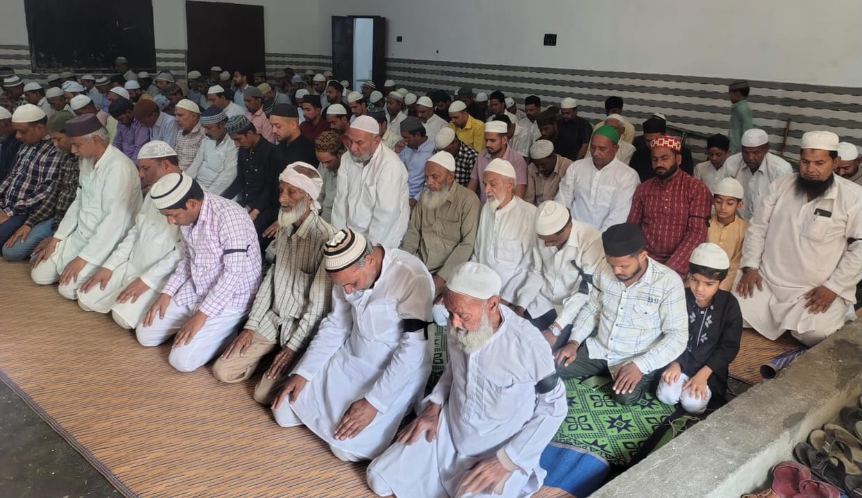 The Muslim community offered namaz by wearing black bands
