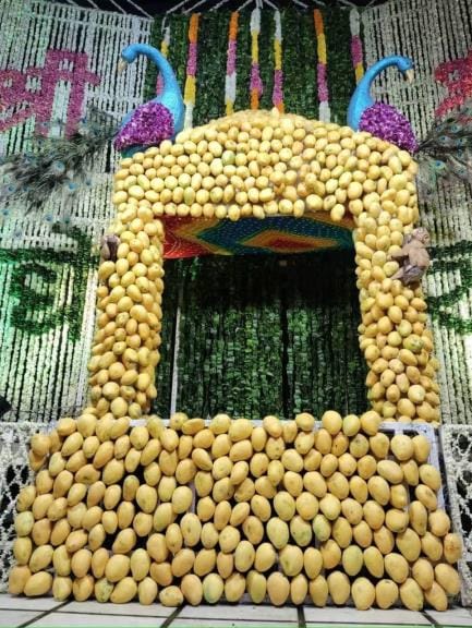 Thakur Shri Banke Bihari is seated in a bungalow made of mangoes