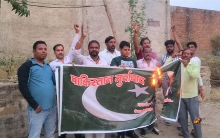 Burnt Pakistani flag and raised slogans