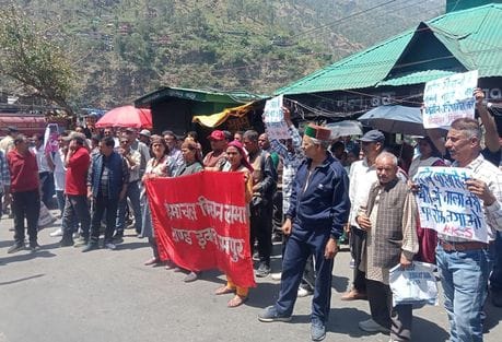 A protest rally was taken out in Rampur over the eviction of farmers from their occupied land