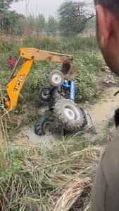A farmer died after being crushed to death when a tractor overturned in a canal, another injured