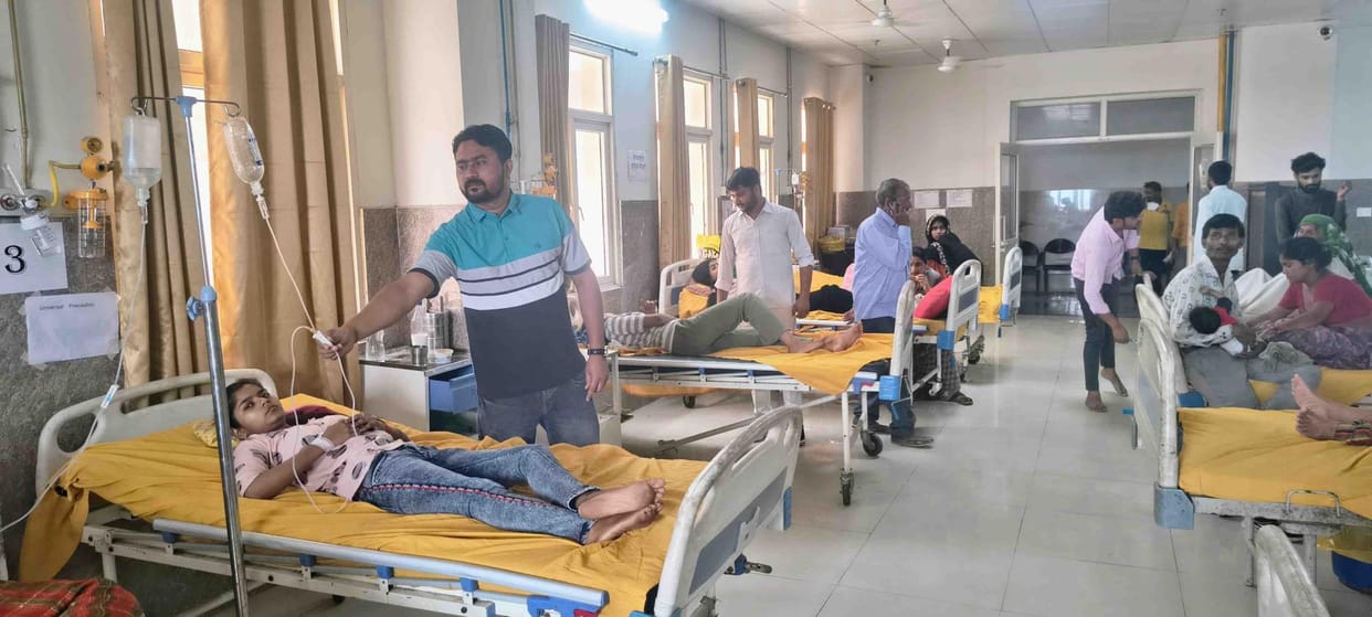 Medicine ward filled with patients suffering from vomiting, diarrhea and fever