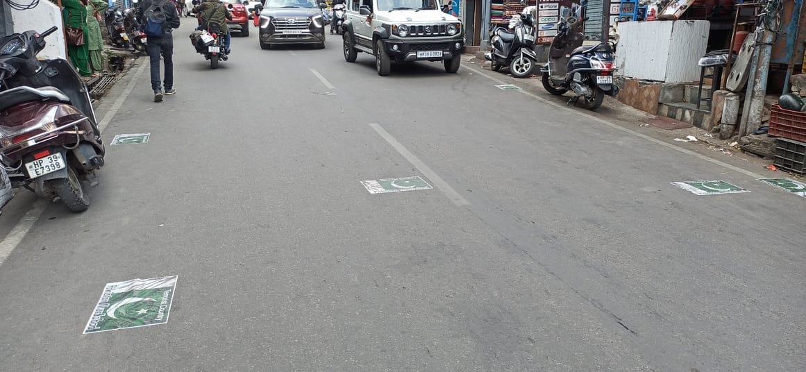 A girl uprooted anti-Pakistan posters and pasted them on the road, causing huge uproar