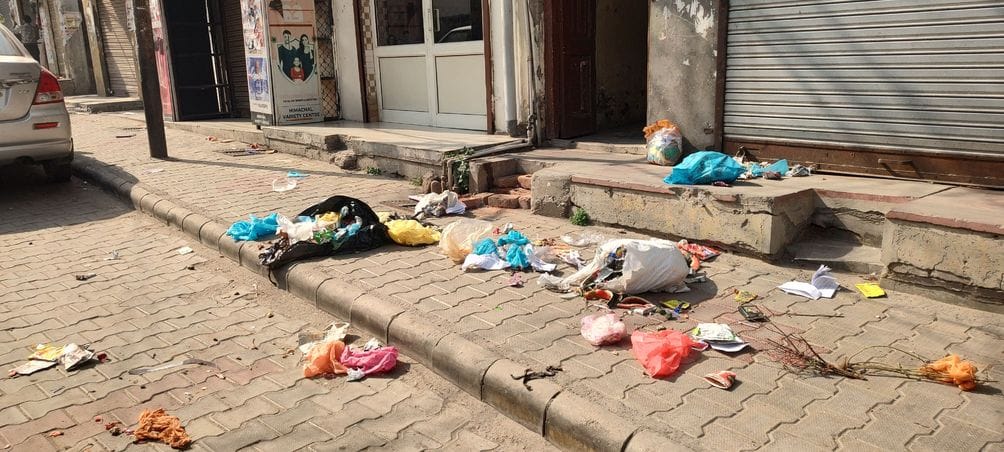 Sanitation workers protest, heaps of garbage pile up in the city