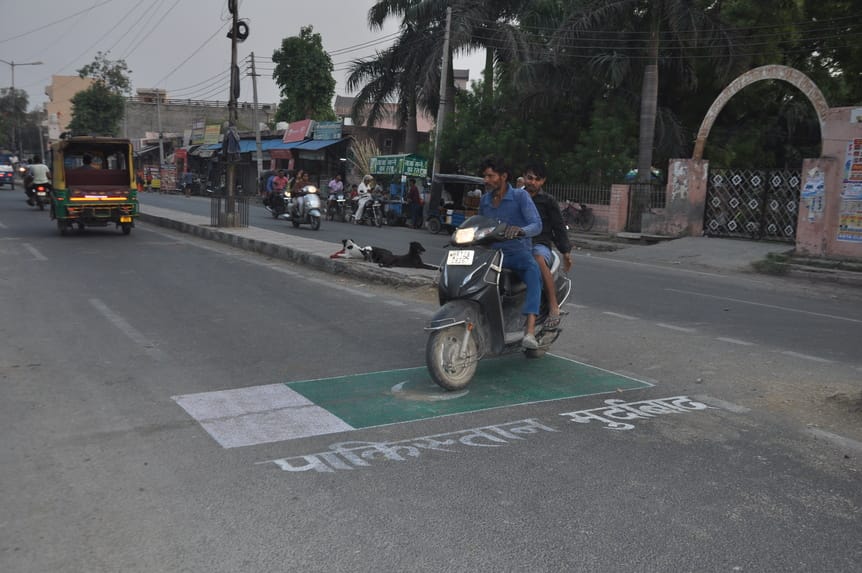 Pakistan flag made on the road, Pakistan Murdabad written on it
