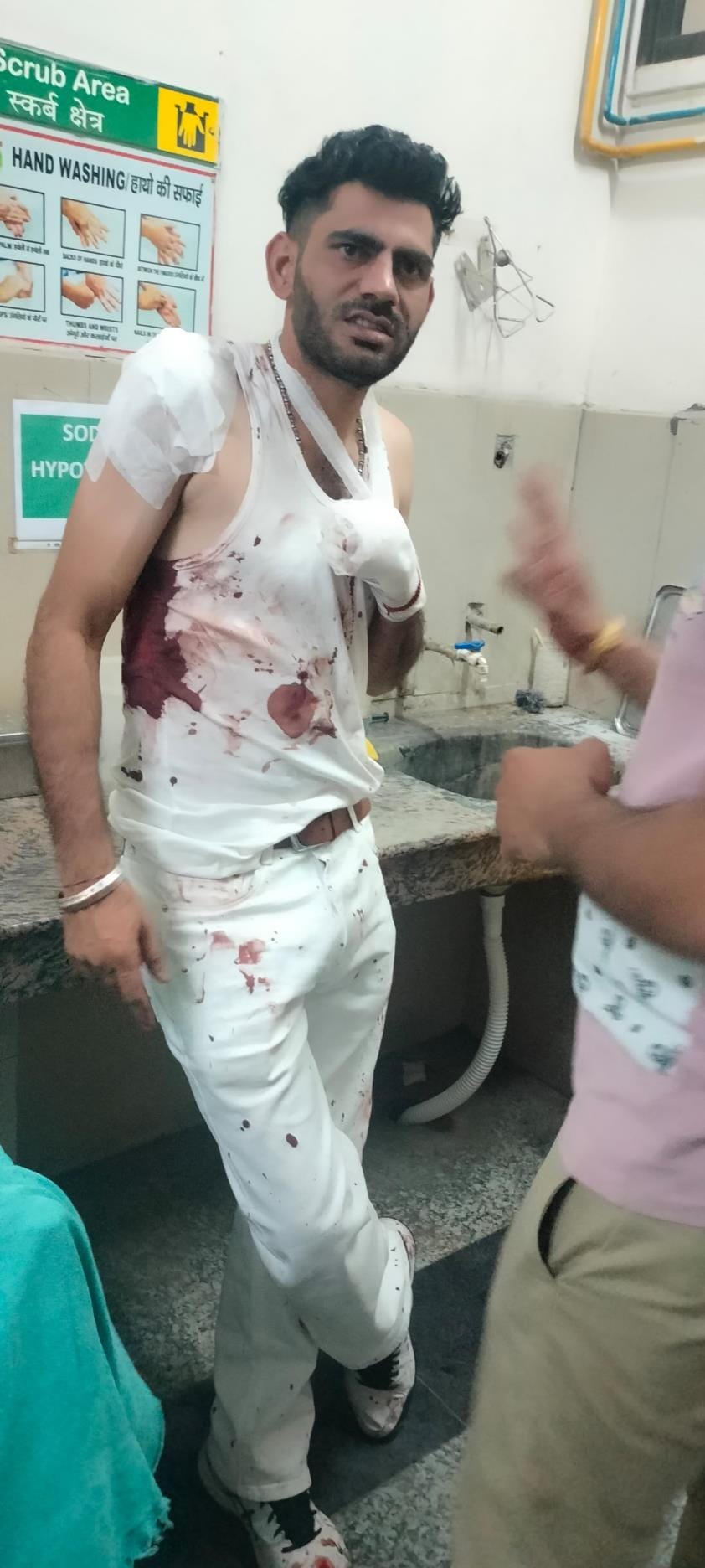 When he was stopped from creating ruckus at a wedding, a youth was stabbed in the back with a knife and a liquor bottle was broken on his head