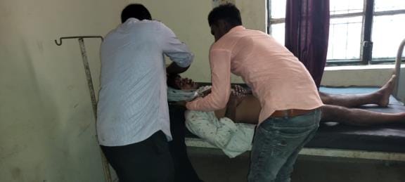 Two youths trying to intervene in a fight were attacked with a knife