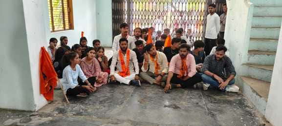 ABVP workers staged a sit-in protest at the college gate