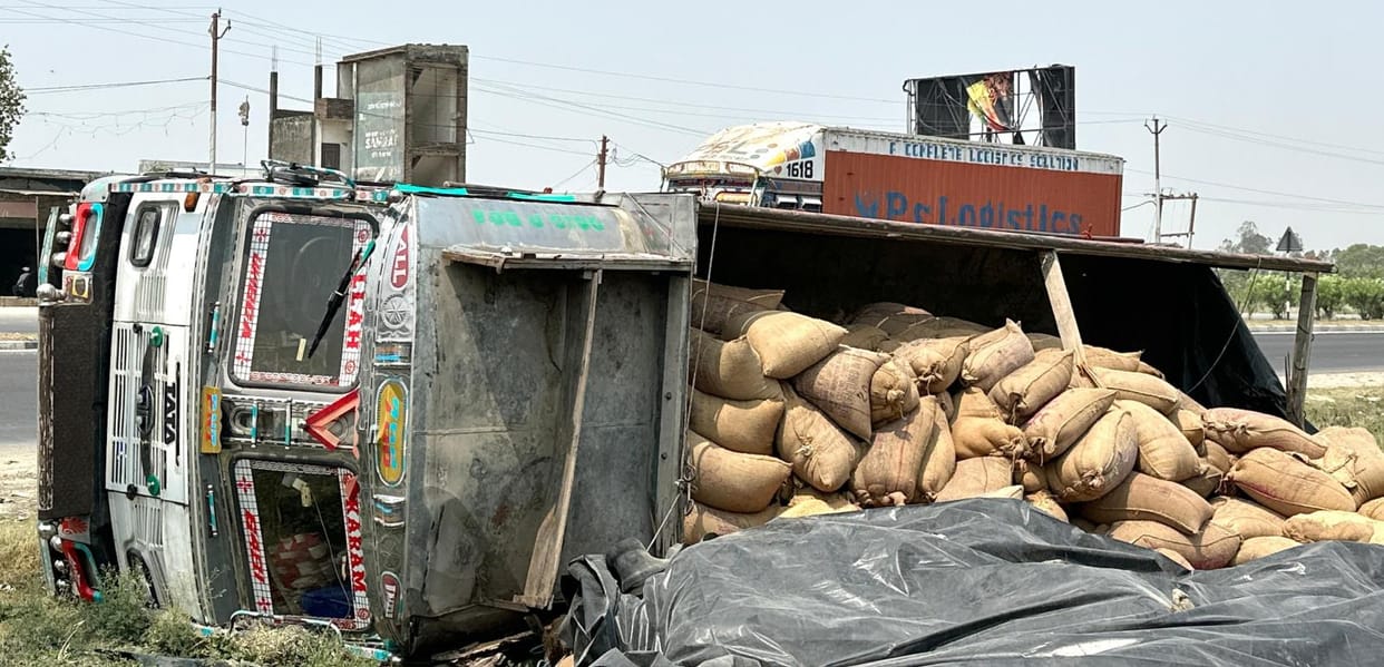 A truck loaded with wheat overturned after going out of control on the highway