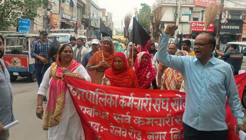 Sanitation and fire brigade workers demonstrated with brooms