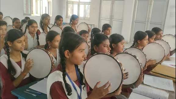 Girls are learning dholak in the campaign of culture through music