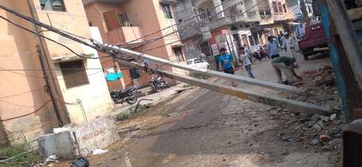 Two poles of HT line broke due to falling debris of the house