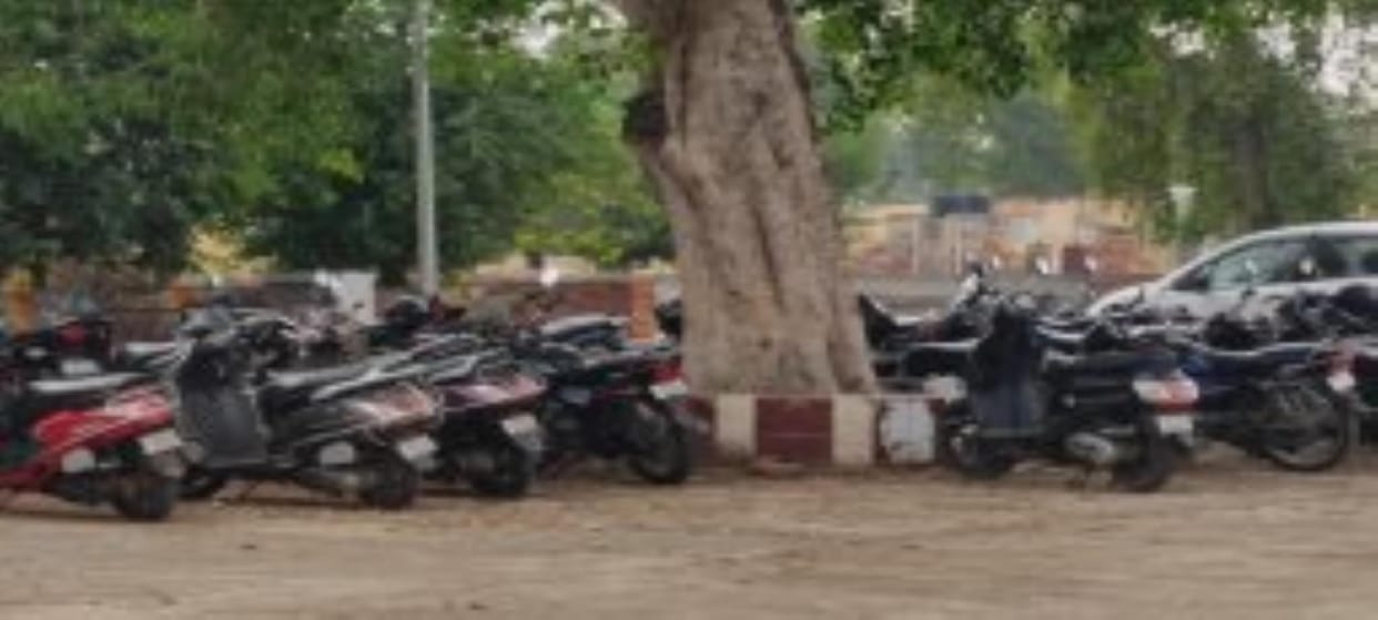 Lack of parking system at railway station, passengers are parking their vehicles at their own risk