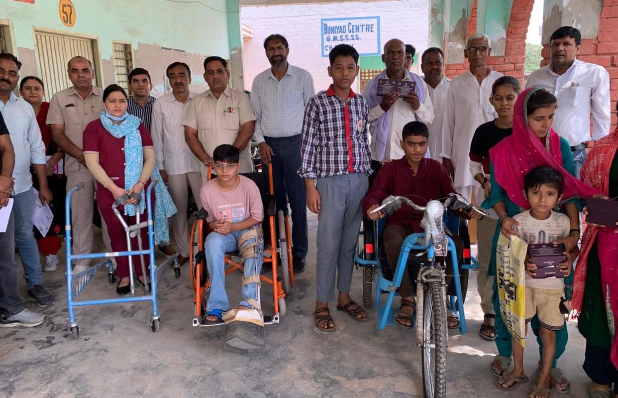 Divyang students were delighted after getting electric rickshaws, wheelchairs and hearing aids