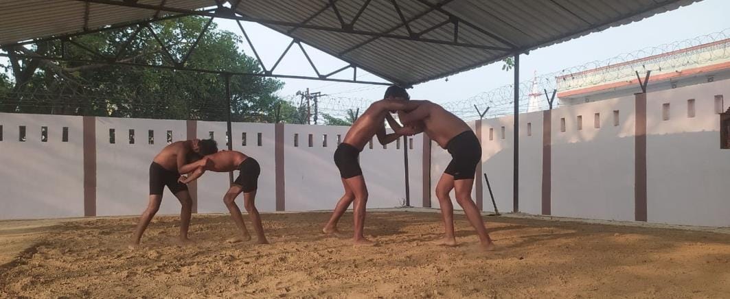 Wrestlers learning wrestling tricks in the stadium