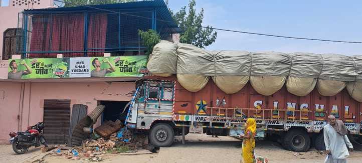 A truck loaded with bagasse went out of control and entered a house, driver and woman injured
