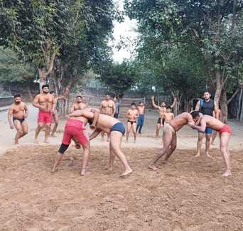 Wrestlers are getting ready in the arena of Police Line