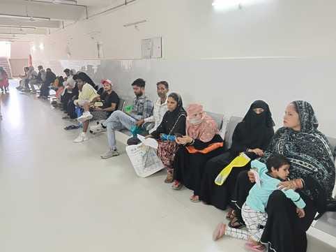 Crowd of patients in the hospital, doctor absent