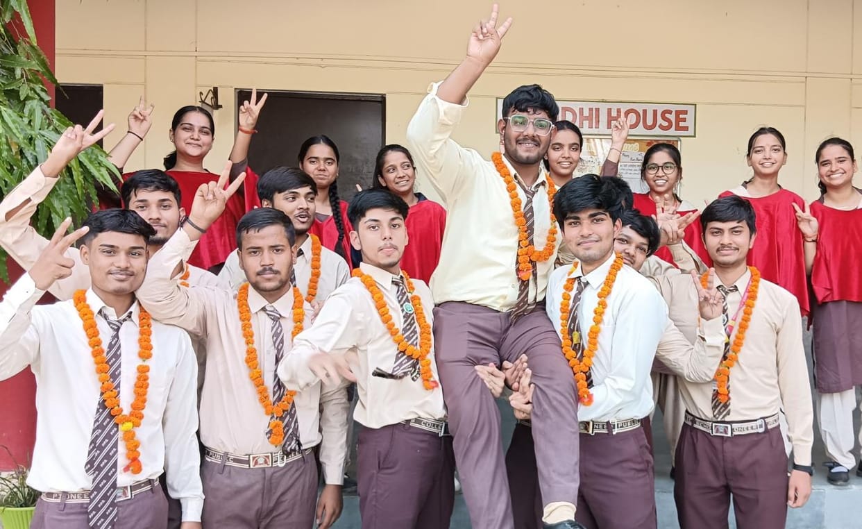 Faces lit up with success in crossing the first step of the exam