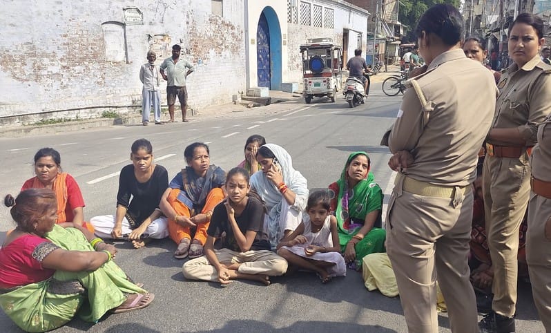 The family members sat on the road demanding action against the accused
