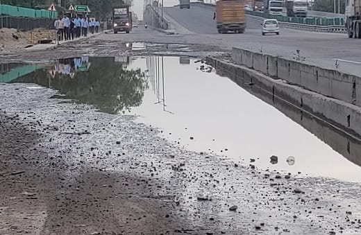 Drain water filled on the service lane of the highway in Dharuhera