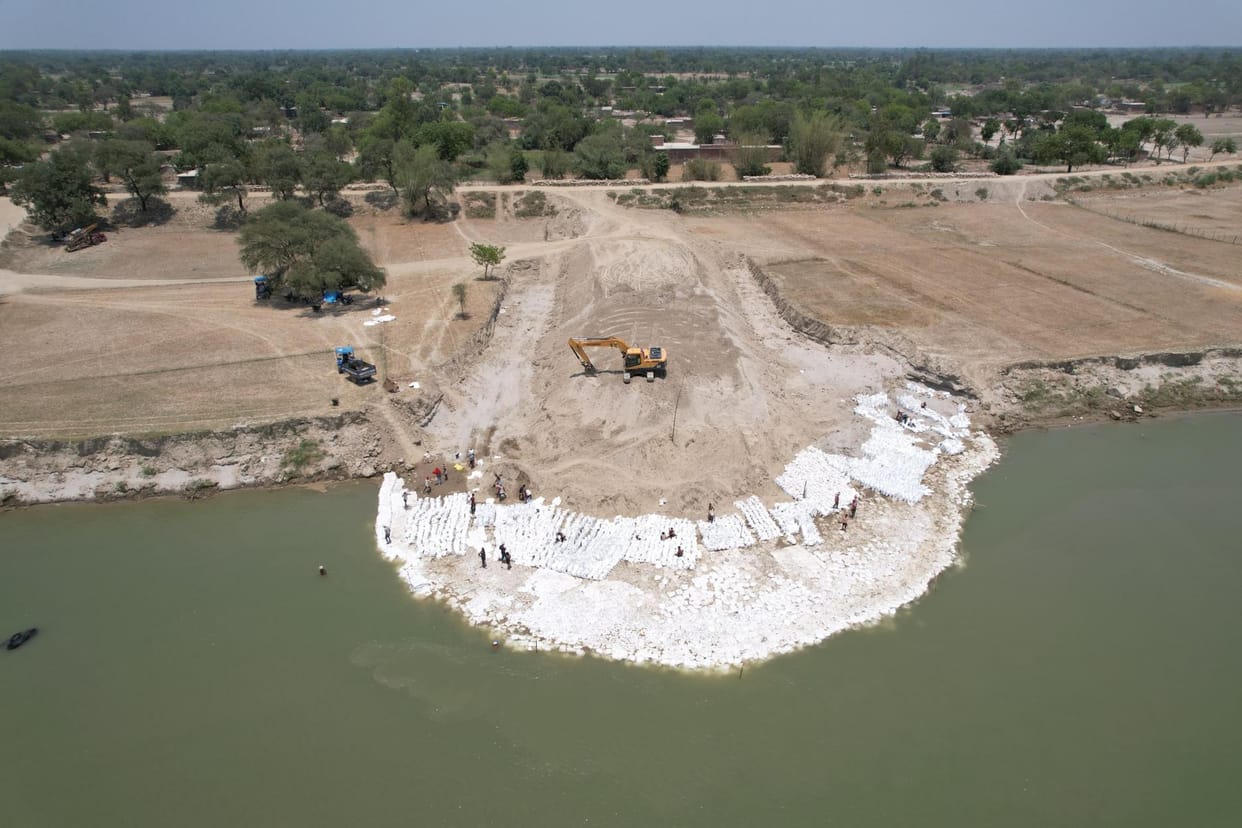 Construction of a barrier between the river and the dam