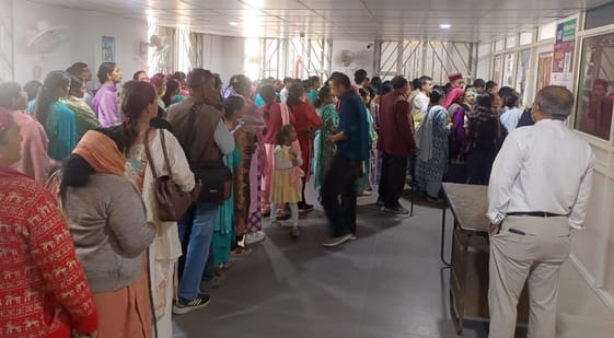 Four registration counters, yet lines are being formed to get slips